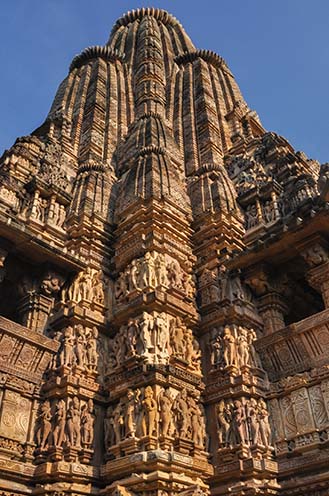 Monuments-  Khajuraho Temples (Madhya Pradesh) - Details of Kandariya Mahadeva Hindu temple at Khajuraho, Madhya Pradesh, India. by Anil