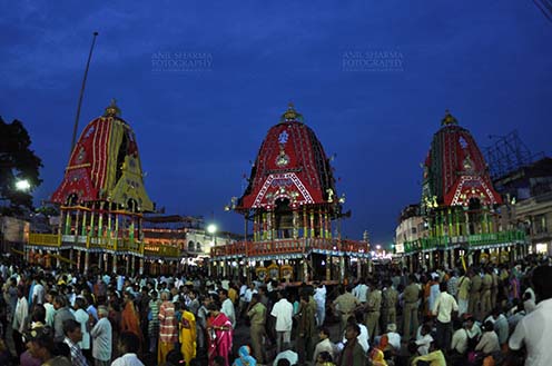 Festivals- Jagannath Rath Yatra (Odisha) - The chariots of Lord Jagannath, Balbhadra and Subhadra traditionally decorated, parked in front of the Jagannath temple at Puri, Odisha, India. by Anil