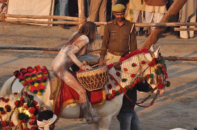 Religion- Naga Sadhu\u2019s at Mahakumbh (India) - Naga sadhu on horseback at Mahakumbh Allahdbad, Uttar Pradesh, India. by Anil