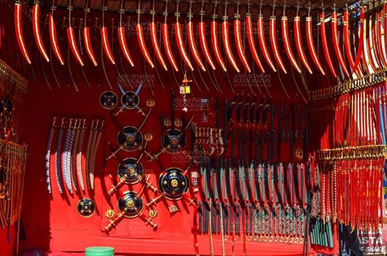 Fairs- Pushkar Fair (Rajasthan) - DSC_0063-1 Pushkar, Rajasthan, India- January 16, 2018: A shop of traditional Rajasthani swords at Sadar Bazaar, Pushkar, Rajasthan, India. by Anil