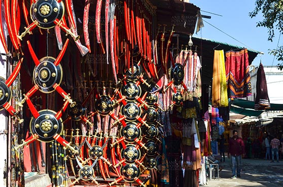 Fairs- Pushkar Fair (Rajasthan) - Pushkar, Rajasthan, India- January 16, 2018: A shop of traditional Rajasthani swords at Pushkar, Rajasthan, India. by Anil