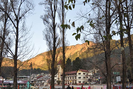 Travel- Nainital (Uttarakhand) - Nainital, Uttarakhand, India- November 11, 2015: View of Cheena peak and Nainital city from Boat House Club at Mallital, Nainital, Uttarakhand, India. by Anil