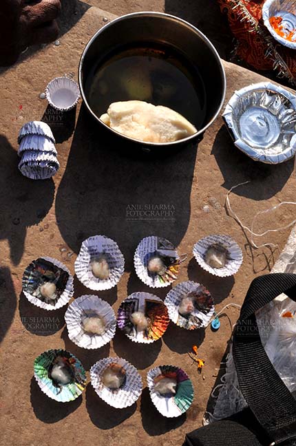 Travel- Varanasi the city of light (India) - Cow butter on paper plates for puja. by Anil