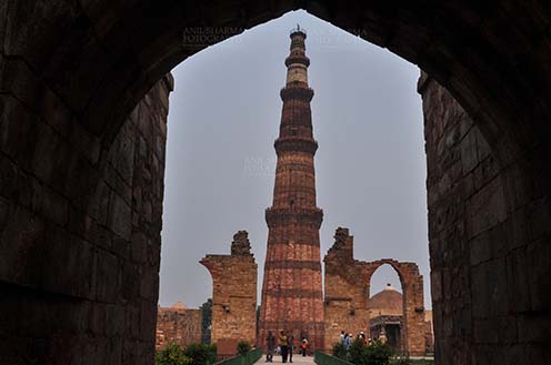 Monuments- Qutab Minar, New Delhi, India. - Qutab Minar, minaret tower with verses from Holy Quran at Qutab Minar Complex, New Delhi, India. by Anil