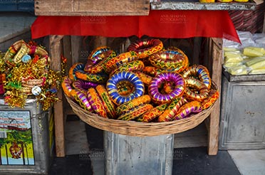 Fairs- Pushkar Fair (Rajasthan) - Pushkar, Rajasthan, India- January 16, 2018: Traditional Rajasthani Bracelets at a shop, Pushkar, Rajasthan, India. by Anil