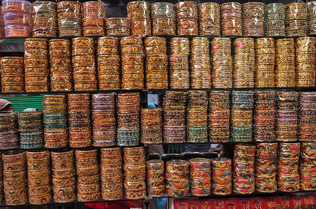 Religion- Dargah Sharif, Ajmer, Rajasthan (India) - Colourful bangles shop at shine market place of Ajmer Sharif Dargah the Mausoleum of Moinuddin Chishti, a sufi saint from India at Ajmer, Rajasthan, India. by Anil