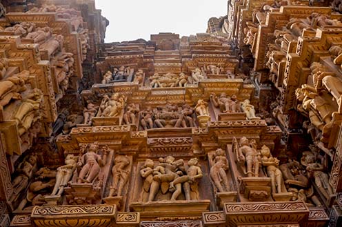 Monuments-  Khajuraho Temples (Madhya Pradesh) - Kama Sutra Khajuraho, erotic sex love and romance sculptures on Khajuraho temple walls at Khajuraho, Madhya Pradesh, India. by Anil