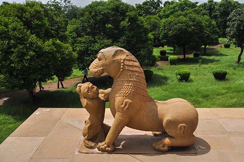Monuments-  Khajuraho Temples (Madhya Pradesh) - Stone statue of a Lady playing with a Lion at Kandariya Mahadev Temple at Khajuraho, Madhya Pradesh, India. by Anil