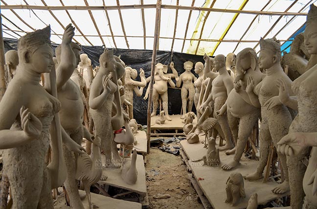 Festivals- Durga Puja Festival - Durga Puja Festival, Noida, Uttar Pradesh, India- September 17, 2017: Clay idol sculpture of Hindu Goddess and Gods at a workshop in preparation for the “Durga Puja” the biggest festival of Hindu community in Indian subcontinent. by Anil