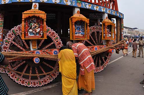 Festivals- Jagannath Rath Yatra (Odisha) - Devotee’s praying to the idols assembled on the chariot for Jagannath Rath Yatra festival at Puri, Odisha, India. by Anil