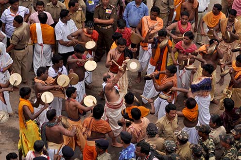 Festivals- Jagannath Rath Yatra (Odisha) - Devotees singing and dancing on the occasion of Rath Yatra at Puri, Odisha, India. by Anil