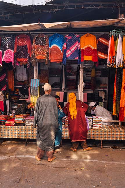 Religion- Dargah Sharif, Ajmer, Rajasthan (India) - Muslim man selling “Chhador” in a shop inside the Moinuddin Chishti Mausoleum (i.e. the “Dargah Sharif”) by Anil