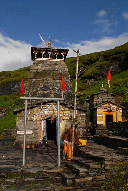 Religion- Tungnath Temple, Uttarakhand (India) - Tungnath, Chopta, Uttarakhand, India- August 18, 2009: Hanging bells and red color flags at Tungnath temple complex at Tungnath, Chpota, Uttarakhand, India. by Anil