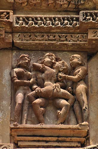 Monuments-  Khajuraho Temples (Madhya Pradesh) - Erotic sculpture at the Kandariya Mahadev temple complex in Khajuraho in Madhya Pradesh, India. by Anil