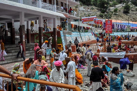 Travel- Gangotri (Uttarakhand) - Gangotri, Uttarakhand, India- June 14, 2013:  Devotees at Goddess Ganges Temple to perform prayer ritual and to have holy dip into Bhagirathi River at Gangotri, Uttarkashi, Uttarakhand, India. by Anil