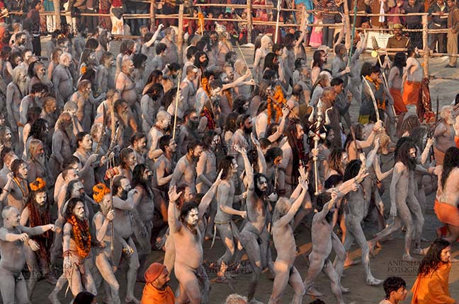 Religion- Naga Sadhu\u2019s at Mahakumbh (India) - Large number of Naga sadhus marching towards ghat at Allahabad, Uttar Pradesh, India. by Anil