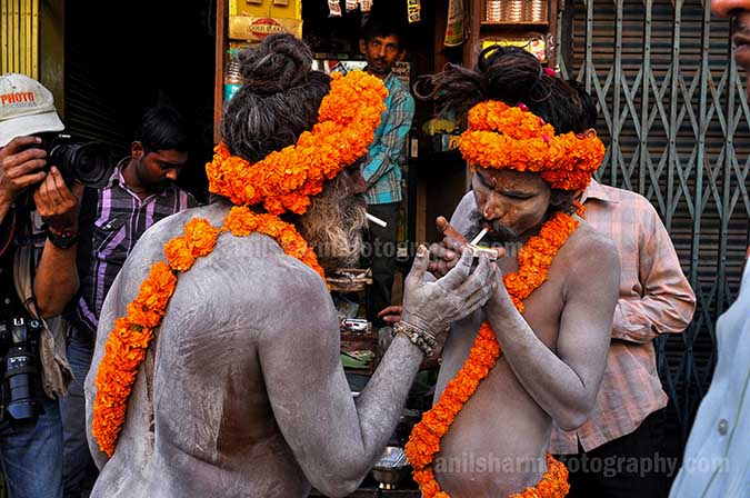 Culture- Naga Sadhu\u2019s (India) - Naga Sadhu’s  litting cigarette. by Anil