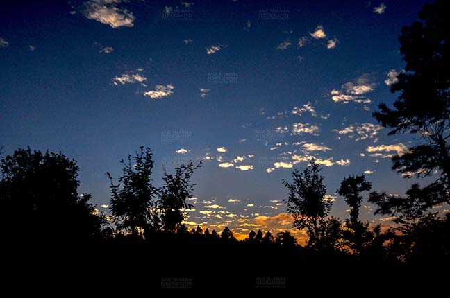 Clouds- Sky with Clouds (Almora) - Clouds, Almora, Uttarakhand, India- November 4, 2016: After sunset, dark blue sky with small pathces of white clouds in the evening at Almora, Uttarakhand, India by Anil