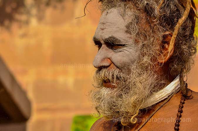 Culture- Naga Sadhu\u2019s (India) - Smile on the face of an elderly Naga Sadhu at Ghat. by Anil