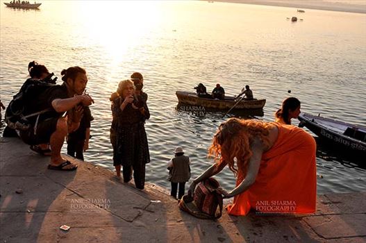 A foreign devotee after taking bath in Holy River Ganges at Varanasi, Uttar Pradesh, India.