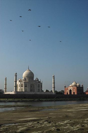 Back side view of Taj Mahal, with blue sky and river yamuna flowing at Agra, Uttar Pradesh, India.