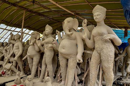 Durga Puja Festival, Noida, Uttar Pradesh, India- September 17, 2017: Clay idols of Hindu Gods and Goddess in a workshop under Preparation for the traditional Durga Puja festival at Noida, Uttar Pradesh, India.