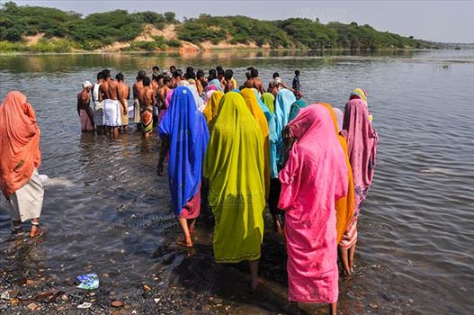 Baneshwar, Dungarpur, Rajasthan, India- February 14, 2011: Devotees ready for the traditional ritual bath at the confluence of the rivers, Mahi and Som at Baneshwar, Dungarpur, Rajasthan, India.