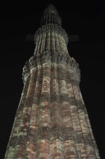 Qutub Minar a UNESCO World Heritage Site in night at Qutub Minar Complex, Mehrauli , New Delhi, India.