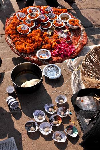 Hindu devotees use marigold, raised flowers, cotton, ghee, red powder and other material in puja.