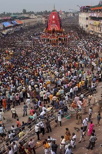 Massive chariot of Lord Balbhadra surrounded by thousands of enthused pilgrims, for Jagannath Rath Yatra festival at Puri, Odisha, India.