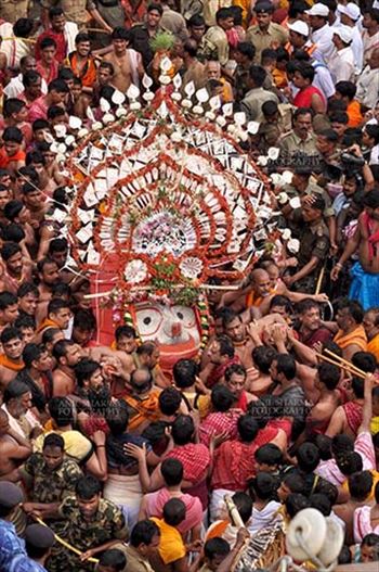 Deity of Balbhadra being taken to the chariot on the occasion of Rath Yatra at Puri, Odisha, India.