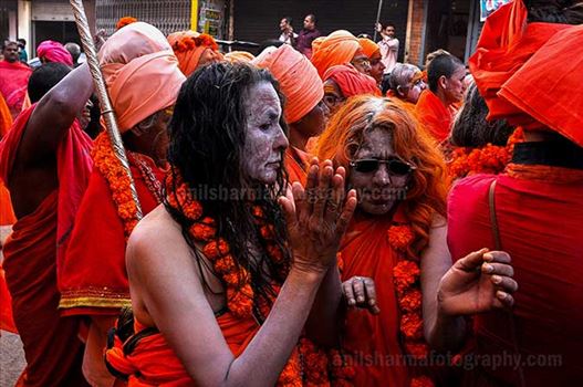 Women Naga Sadhu's procession passing through the streets of Varanasi.