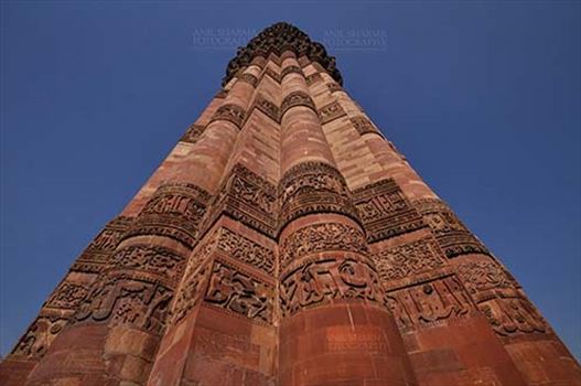 Qutab Minar with Architecure details and verses from Holy Quran at Qutab Minar Complex, New Delhi, India.