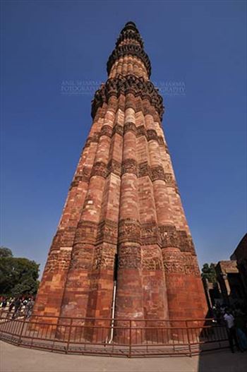 Qutab Minar with verses from Holy Quran, the Tallest brick Minaret at Qutab Minar Complex, New Delhi, India.