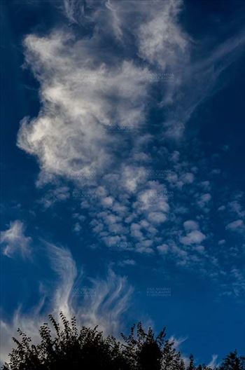Clouds over Lansdowne, Uttarakhand, India- November 24, 2016: Dark blue sky with white clouds performing dance early in the morning over Lansdowne, Uttarakhand, India.