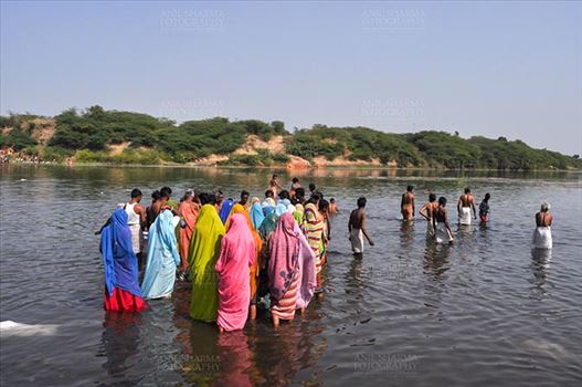 Baneshwar, Dungarpur, Rajasthan, India- February 14, 2011: Devotees ready for the traditional ritual bath at the confluence of the rivers, Mahi and Som at Baneshwar, Dungarpur, Rajasthan, India
