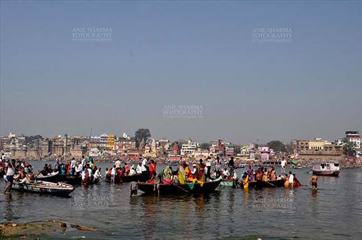 A panoramic view of Varanasi Ghats- Sadhu’s and devotee’s using boats to cross Holy River Ganga at Varanasi, Uttar Pradesh, India.