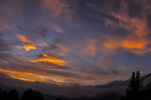 Clouds, Chopta Tungnath, Uttarakhand, India- July 29, 2011: Blue sky with orange clouds in the evening at Chopta Tungnath, Uttarakhand, India.